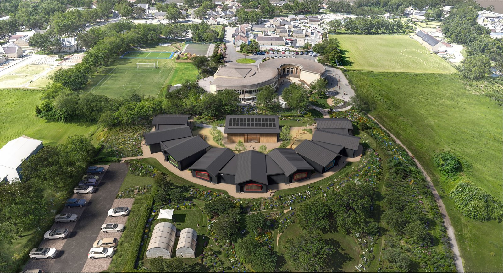 Architect's aerial view of the planned expansion: a crescent of new dark-timber classrooms with coloured window frames around a central timber building, set in gardens behind the existing school